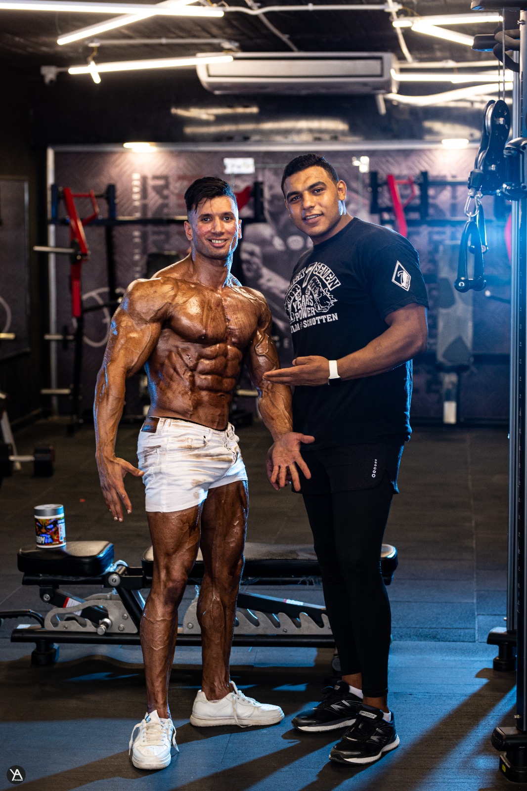 Adel leaning into a massive training tire mid-effort